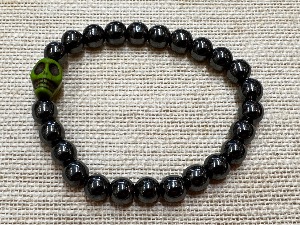 Hematite 8mm Beads with 10mm Magnesite Skull Bead - 20cm Elasticated Bracelet  (ref SHMB122865)